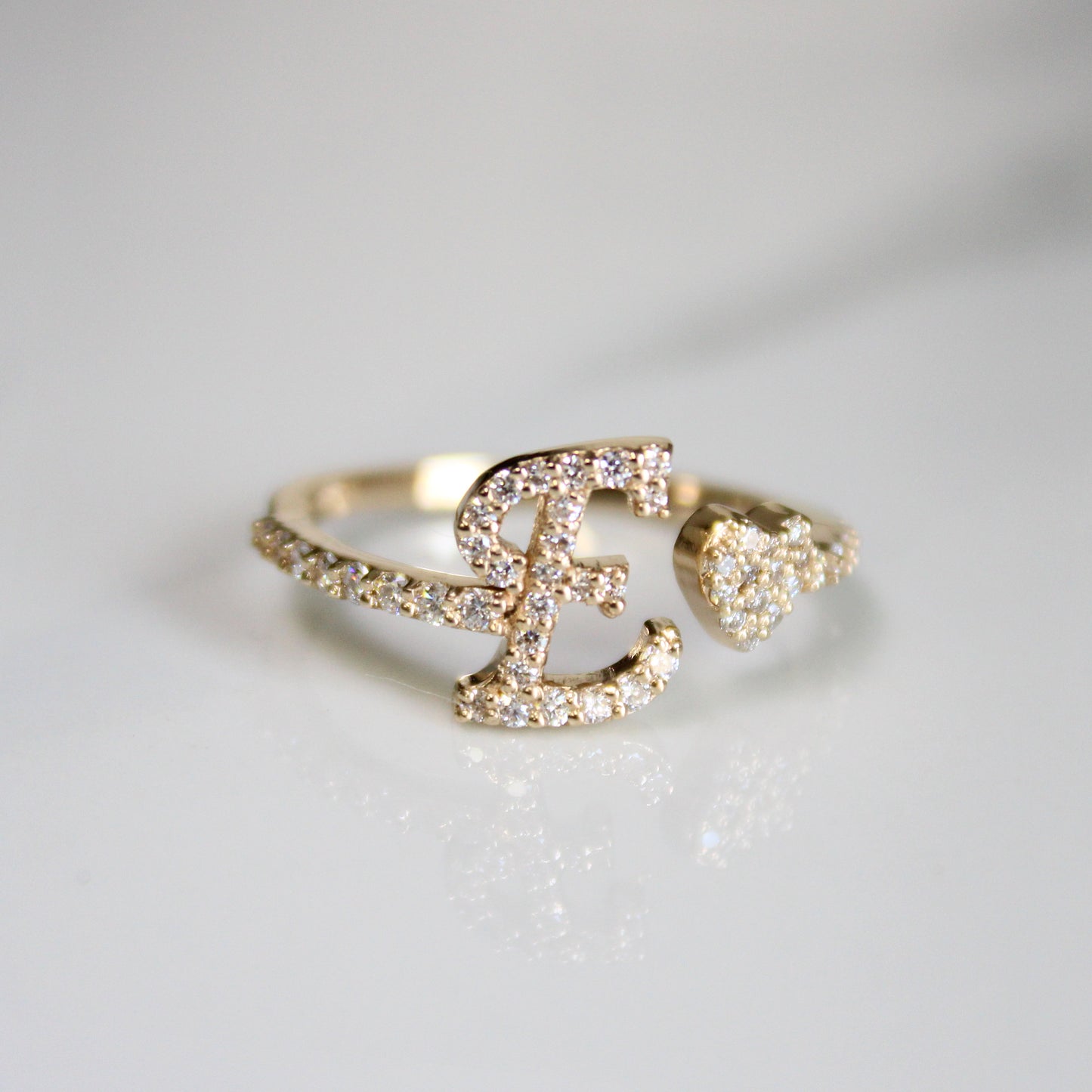 14kt gold and diamond letter E ring